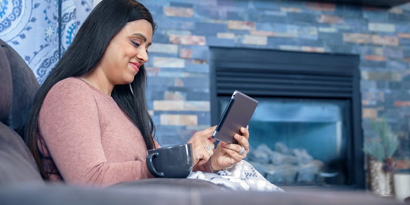A woman researching mortgage loan buydowns on her tablet