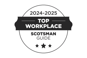 A circular badge with a ribbon reads 2024-2025 Top Workplace Scotsman Guide and features three stars at the bottom, indicating an award or recognition.