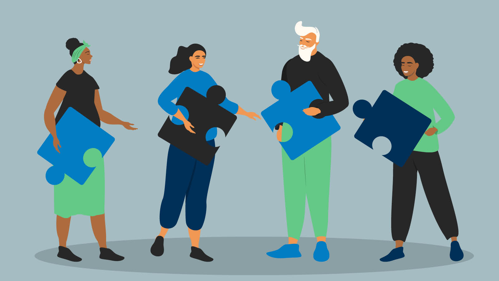 A group of people putting puzzle pieces together