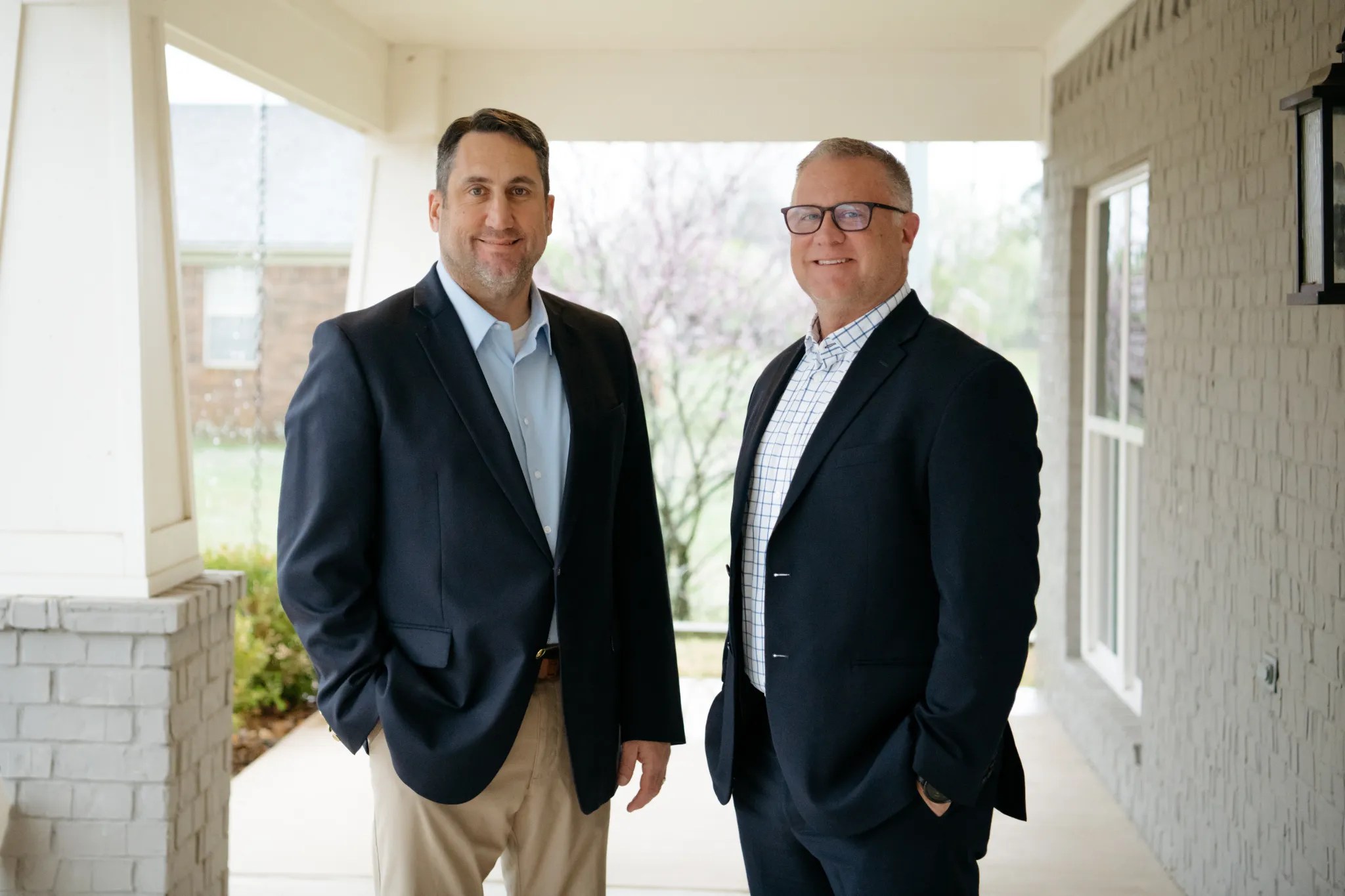 Donny Bradley and Joey Fulgham pose for a photo on a porch. Photo courtesy of Pulse of Conway